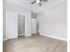 Spacious bedroom with a fan, closet, and doorways into other rooms at 1900 Blue Bird Rd., Loris, SC 29569