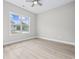 Bright bedroom with a ceiling fan, large window and views of the neighborhood at 1900 Blue Bird Rd., Loris, SC 29569