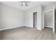 Neutral bedroom featuring a ceiling fan, closet and doorway to another room at 1900 Blue Bird Rd., Loris, SC 29569