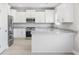 Modern kitchen featuring white cabinets, granite countertops, and stainless steel appliances at 1900 Blue Bird Rd., Loris, SC 29569