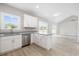 Bright kitchen featuring granite countertops, white cabinets, and open floor plan at 1900 Blue Bird Rd., Loris, SC 29569
