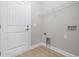 Small laundry room with vinyl flooring and wire shelving at 1900 Blue Bird Rd., Loris, SC 29569