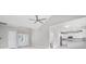 Open-concept living space featuring vaulted ceilings, light floors, and a seamless flow into the modern kitchen at 1900 Blue Bird Rd., Loris, SC 29569