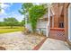 Brick house has a backyard deck with pergola, offering a peaceful spot to enjoy the outdoor scenery at 1961 Bright Rd., Little River, SC 29566