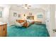 Bedroom with vaulted ceiling, ceiling fan, unique wood bed, and large windows at 1961 Bright Rd., Little River, SC 29566