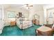 Charming bedroom with floral bedding, classic furnishings, and ample natural light from multiple windows at 1961 Bright Rd., Little River, SC 29566