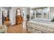 Spacious bedroom features hardwood floors, natural light, and an antique dresser at 1961 Bright Rd., Little River, SC 29566