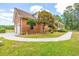 Beautiful brick house with well-maintained landscaping, featuring a curved walkway and attached garage at 1961 Bright Rd., Little River, SC 29566