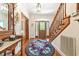 Inviting foyer with hardwood floors, staircase, and decorative rug and console table at 1961 Bright Rd., Little River, SC 29566