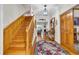 Grand foyer showcasing hardwood floors, an elegant staircase, and decorative accents at 1961 Bright Rd., Little River, SC 29566