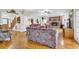 Cozy living room with hardwood floors, brick fireplace, and comfortable seating at 1961 Bright Rd., Little River, SC 29566