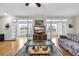 Open living room with hardwood floors, French doors, and a decorative glass coffee table at 1961 Bright Rd., Little River, SC 29566