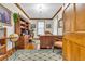 Office with hardwood floors, a large desk, bookshelves, a globe, and natural light at 1961 Bright Rd., Little River, SC 29566