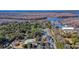 Aerial view of community amenities including a pool, clubhouse, and tennis courts near a harbor at 1969 Governors Landing Rd. # 224, Murrells Inlet, SC 29576