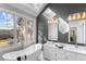 Modern bathroom with a soaking tub, double vanity, skylight, and large windows at 1969 Governors Landing Rd. # 224, Murrells Inlet, SC 29576