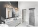 Stylish bathroom boasting a double vanity, shower, and elegant gray accent wall at 1969 Governors Landing Rd. # 224, Murrells Inlet, SC 29576