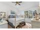 Bright bedroom featuring a four-poster bed, ceiling fan, and large windows offering natural light at 1969 Governors Landing Rd. # 224, Murrells Inlet, SC 29576