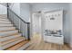 Hallway with wood stairs and a convenient coat rack with storage bench at 1969 Governors Landing Rd. # 224, Murrells Inlet, SC 29576