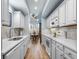 Bright kitchen with white cabinetry, stainless steel appliances, and a view into the dining room at 1969 Governors Landing Rd. # 224, Murrells Inlet, SC 29576