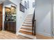 Elegant staircase with wood and white risers, complemented by modern finishes and a stylish display cabinet at 1969 Governors Landing Rd. # 224, Murrells Inlet, SC 29576