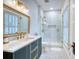 Bathroom featuring a sleek vanity, white countertop and modern shower with white subway tile at 203 Broad St., Georgetown, SC 29440