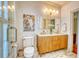 Beautiful bathroom features a double sink vanity, designer tile, and walk-in shower with glass door at 203 Broad St., Georgetown, SC 29440