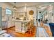 A bright kitchen with a breakfast bar, stainless steel appliances, and light colored cabinetry at 203 Broad St., Georgetown, SC 29440