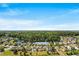 Aerial view of the community with a beautiful lake, lush greenery, and well-manicured lawns at 2336 Windmill Way, Myrtle Beach, SC 29579