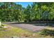 Community basketball court with well-maintained surface and surrounding green space for neighborhood recreation at 2336 Windmill Way, Myrtle Beach, SC 29579