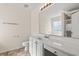 Well-lit bathroom featuring a vanity, mirror, and tile flooring, combining style with functionality at 2336 Windmill Way, Myrtle Beach, SC 29579