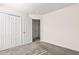 Bright, carpeted bedroom with a closet and a door offers ample space and functionality at 2336 Windmill Way, Myrtle Beach, SC 29579