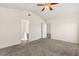 Spacious bedroom with vaulted ceiling, a ceiling fan, closet, and a bathroom entrance at 2336 Windmill Way, Myrtle Beach, SC 29579