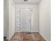 Bright entryway with decorative sidelights and a neutral color palette, creating a welcoming first impression at 2336 Windmill Way, Myrtle Beach, SC 29579