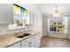 Bright kitchen area with a breakfast nook and granite countertops, offering ample storage at 2336 Windmill Way, Myrtle Beach, SC 29579
