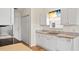 Charming kitchen features white cabinets, granite countertops, and stainless steel appliances at 2336 Windmill Way, Myrtle Beach, SC 29579