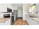 Kitchen features stainless steel appliances, granite countertops, and ample cabinet space at 2336 Windmill Way, Myrtle Beach, SC 29579