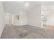 Open-concept living area features a vaulted ceiling and seamless transitions to the kitchen and entryway at 2336 Windmill Way, Myrtle Beach, SC 29579