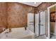Elegant bathroom featuring a tub, shower, and patterned wallpaper at 24 Willowbend Dr., Murrells Inlet, SC 29576
