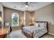 Cozy bedroom with natural light from window and ceiling fan at 24 Willowbend Dr., Murrells Inlet, SC 29576