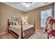 Bedroom featuring a four-poster bed and window, bathed in natural light at 24 Willowbend Dr., Murrells Inlet, SC 29576