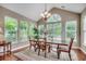 Inviting dining room featuring abundant natural light, a chandelier, and ample seating for entertaining at 24 Willowbend Dr., Murrells Inlet, SC 29576