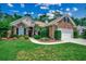 Charming brick home with a well-manicured lawn and inviting landscaping, offering great curb appeal at 24 Willowbend Dr., Murrells Inlet, SC 29576