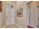 Inviting foyer with tile flooring, a front door with transom window, and neutral wall paint at 24 Willowbend Dr., Murrells Inlet, SC 29576