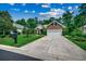Charming brick home with a well-manicured lawn, professional landscaping, and long driveway at 24 Willowbend Dr., Murrells Inlet, SC 29576