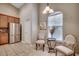 Kitchen nook featuring stainless fridge, table and chairs, and natural light at 24 Willowbend Dr., Murrells Inlet, SC 29576