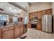 Kitchen with stainless steel appliances, stone counters, and open to dining area at 24 Willowbend Dr., Murrells Inlet, SC 29576