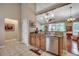 Galley kitchen with stainless steel dishwasher, granite countertop, and tiled flooring at 24 Willowbend Dr., Murrells Inlet, SC 29576