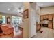 Open-concept living room and kitchen with hardwood floors, and a seamless flow to the dining area at 24 Willowbend Dr., Murrells Inlet, SC 29576