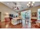 Bright living room with vaulted ceiling, hardwood floors, and seamless access to the dining area at 24 Willowbend Dr., Murrells Inlet, SC 29576