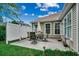 Back patio area with dining furniture and lush green lawn at 24 Willowbend Dr., Murrells Inlet, SC 29576